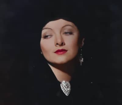 Merna Loy c. 1930s wearing a brooch at her neckline