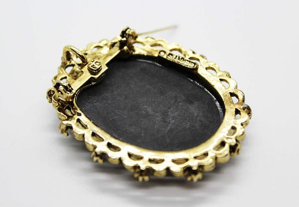 Vintage Gerry's Signed Black & White Cameo Brooch in Gold Tone Frame at whisperingcityrva.com